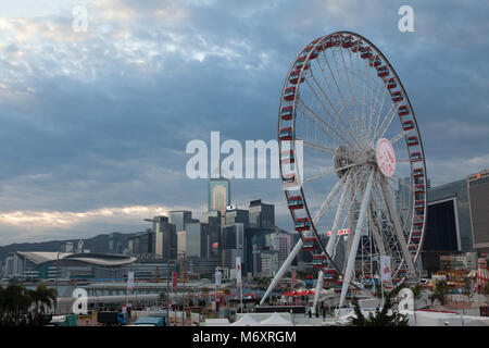 The Central Plaza Tower and Hong Kong Convention and Exhibition Center, seen behind a large Ferris Wheel in Central, Hong Kong, China. Stock Photo