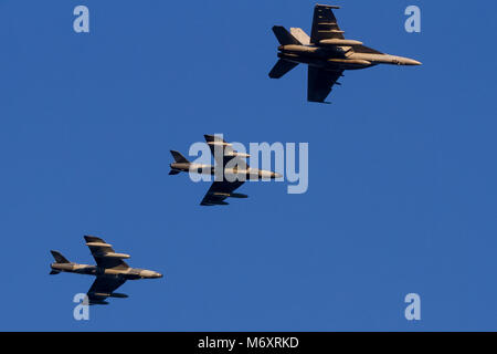 US Navy Boeing iF/A18F Super Hornet and two Airborne Tactical Advantage Company (ATAC) Hawker Hunter Mark 58s, flying over Kanagawa, Japan Stock Photo
