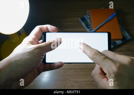 Male hand holding the smartphone Black Stock Photo