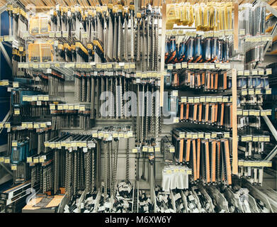 Many drill tool in store for home improvement and DIY. Shallow DOF. drill bits on shelf of building and DIY store. Tools on shelves in department of b Stock Photo