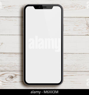 new smartphone similar to iphone X top view on white wood desk Stock Photo