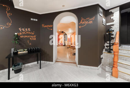 MOSCOW - JULY 2014: Interior of the hookah and anticafe 'MELLOW-YELLOW'. Hall with a table with complimentary tea Stock Photo