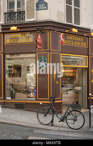 PARIS, FRANCE - MAY 06, 2011:   Bike outside pretty artisan Boulangerie bakery in Rue St Gilles in the Le Marais Quarter Stock Photo