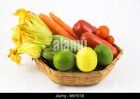 Fresh and ripe vegetables arranged in a basket isolated on white Stock Photo