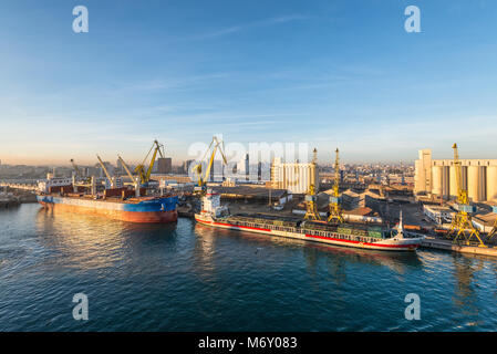 Casablanca, Morocco - December 8, 2016: Discovery Bay Bulk Carrier and Medemborg General Cargo vessel early in the morning at dawn in the seaport of C Stock Photo