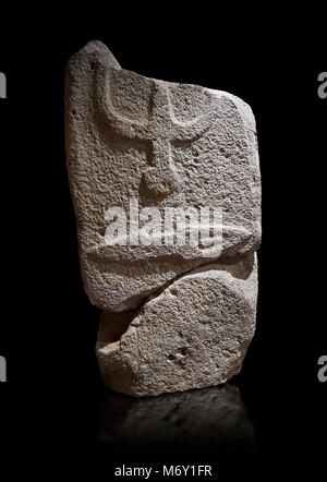 Central fragment of a Late European Neolithic prehistoric Menhir standing stone with carvings on its face side. The representation of a stylalised mal Stock Photo