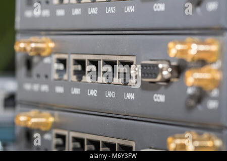 Networking devices WAN, LAN, COM. Close-up networking devices router, switch, connectors Stock Photo