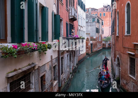 Venice Italy, February 2018. Typical canal scene in Venice with gondola. Stock Photo