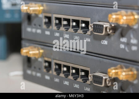 Networking devices WAN, LAN, COM. Close-up networking devices router, switch, connectors Stock Photo