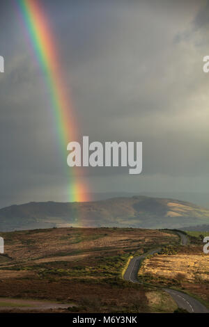 A rainbow over Porlock Hill, Exmoor, Somerset, England, UK Stock Photo