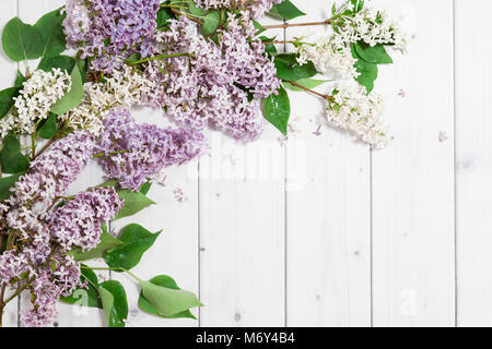 Lilac flowers on the wooden background Stock Photo