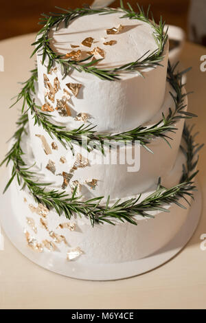 cake decorated with fresh green leaves Stock Photo