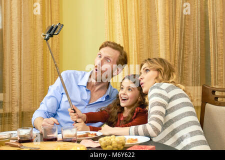 Family taking a funny selfie. Stock Photo