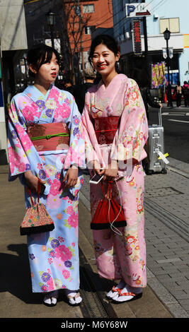 Traditionally dressed Japanese women on Yufumi-dōri in Yufu, Kyushu. Stock Photo