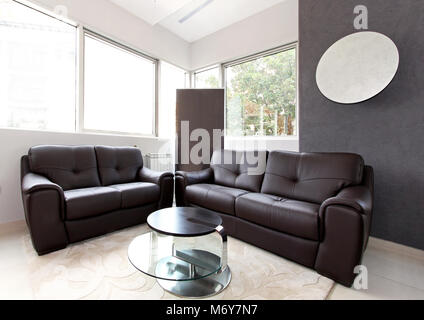 Small living room interior with leather furniture Stock Photo