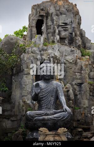 A black Buddha statue within the grounds of the Linh Ung Pagoda, Da Nang, Vietnam Stock Photo