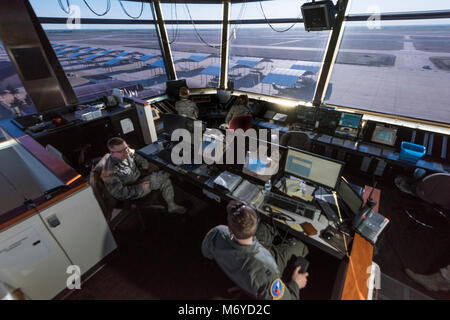 Vance air traffic controllers manage our skies from the Inhofe Air Traffic Control Tower March 1, 2018, at Vance Air Force Base, Okla. Air traffic controllers from the 71st Operations Support Squadron monitor approximately 300 flights and thousands of aircraft movements per day. (U.S. Air Force photo by Airman Zachary Heal) Stock Photo