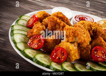 Fried chicken nuggets and vegetables Stock Photo