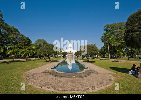 Horizontal view of the Colombo Town Hall and the Buddha statue at Viharamahadevi Park, Colombo Sri Lanka. Stock Photo