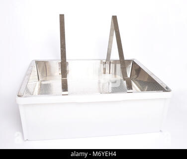Plastic uncapping tub and sieve on white Stock Photo
