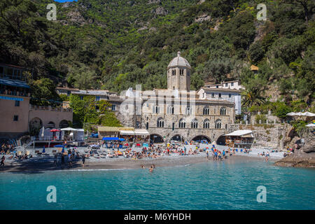 SAN FRUTTUSO DI CAMOGLI, ITALY, MAY, 4, 2016 - San Fruttuoso di Camogli, Ligurian coast, Genoa province, with its ancient Abbaey, the beach and touris Stock Photo