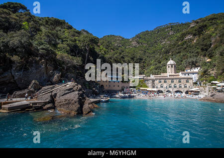 SAN FRUTTUSO DI CAMOGLI, ITALY, MAY, 4, 2016 - San Fruttuoso di Camogli, Ligurian coast, Genoa province, with its ancient Abbaey, the beach and touris Stock Photo