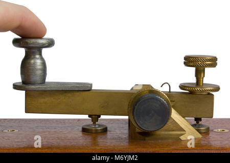 Close up of a telegraph key being used by an operator Stock Photo