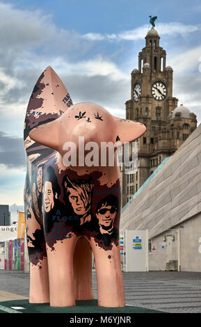 England, Merseyside, Liverpool city, One of the many Superlambanana sculpture ,statues scattered around Liverpool in Merseyside. This one has pop stars painted on it and the Royal Liver Building is in the background. Stock Photo