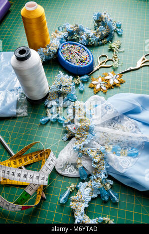 Set for handiwork: Scissors, thread, pins, centimeter, needles, ornaments Stock Photo