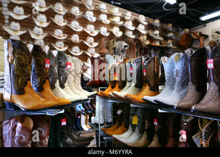 Boots on sale at popular open air store in the Mercado Latino on Edison Highway in East Bakersfield, California.   Photo by Dennis Brack Stock Photo