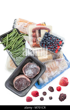 concept of freezing, bunch of frozen food meat, Vegetables, fish, fruits, on a white background Stock Photo