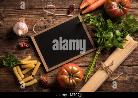 Italian food cooking ingredients. Pasta, vegetables. Top view with copy space Stock Photo