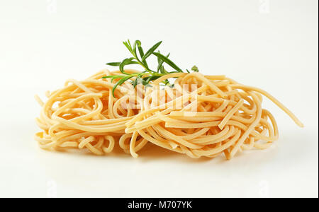 bundles of uncooked spaghetti pasta on white background Stock Photo