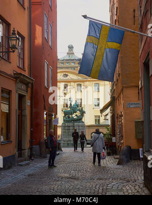 Swedish flag and Statue of St George and the dragon, Gamla Stan, Stockholm, Sweden, Scandinavia. Stock Photo