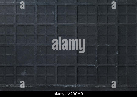 Texture of Ceramic Scratched Tile with Checkered Embossing. Black Scratched Wall Background Stock Photo