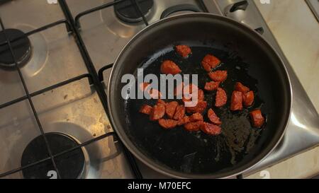 Cooking with sausages Stock Photo