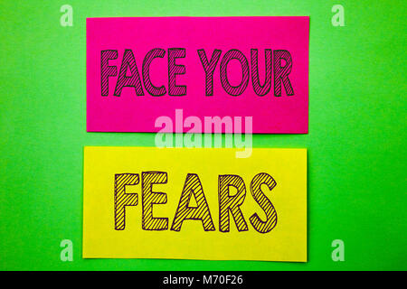 Handwriting Announcement text showing Face Your Fears. Conceptual photo Challenge Fear Fourage Confidence Brave Bravery written sticky note paper the  Stock Photo