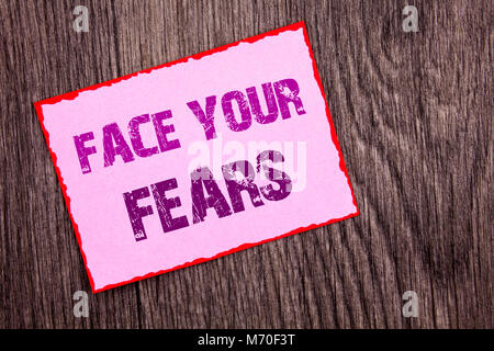 Handwriting Announcement text showing Face Your Fears. Conceptual photo Challenge Fear Fourage Confidence Brave Bravery written Pink Sticky Note Paper Stock Photo