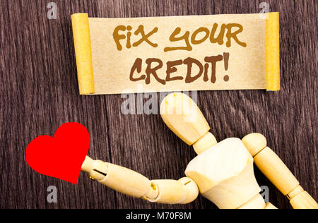 Text sign showing Fix Your Credit. Conceptual photo Bad Score Rating Avice Fix Improvement Repair written Sticky Note Love Heart Holding By Sculpture  Stock Photo