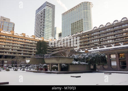 LONDON, UK -28th Feb 2018: Heavy snow falls across the Barbican lake caused by snow storm Emma. Stock Photo