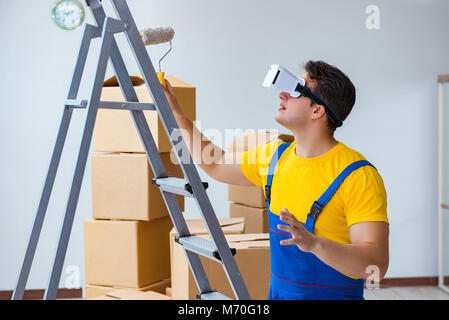 Painter contractor working with virtual reality goggles Stock Photo
