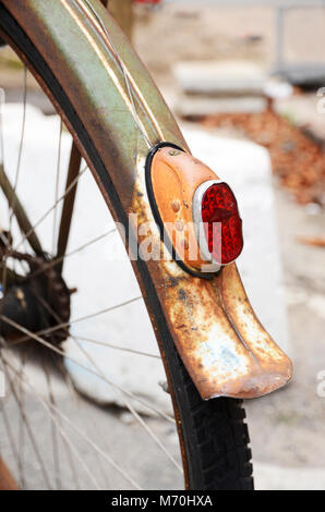 Detail of the back wheel of a rusty vintage bicycle