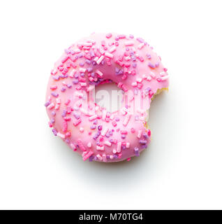 Pink bitten donut isolated on white background. Stock Photo