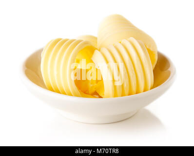 Bowl of butter curls isolated on white background Stock Photo