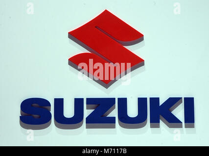 07 March 2018, Switzerland, Geneva: The logo of carmaker Suzuki is displayed during the 2nd Press Day at the 2018 Geneva Motor Show. The Geneva Motor Show runs from 8 March to 18 March 2018. Credit: dpa picture alliance/Alamy Live News Stock Photo