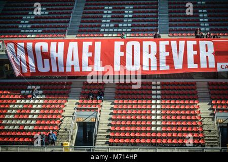 Barcelona, Spain. 7 March, 2018:  Ferrari fans hang up a giant placard reading 'Michael forever' during day six of Formula One testing at Circuit de Catalunya in honor of former seven time Formula One World Champion, who spent the majority of his career at Ferrari, and suffered a traumatic brain injury in a skiing accident in 2013. Credit: Matthias Oesterle/Alamy Live News