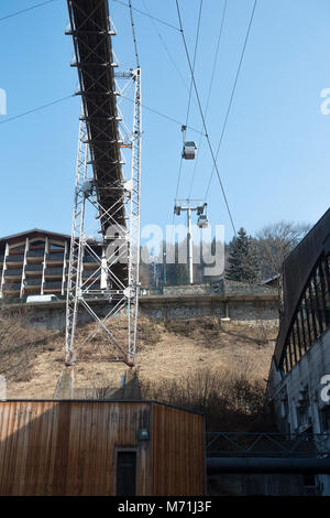 A Gondola Running Alongside a Suspension Bridge Walkway in the Ski Resort of Morzine Portes du Soleil Haute Savoie France Stock Photo