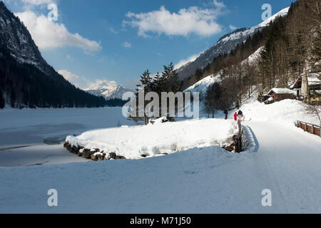 The Beautiful Frozen Lac de Montriond with Snow Covered Roc D'Enfer Mountain from Ardent Haute Savoie Portes du Soleil France Stock Photo