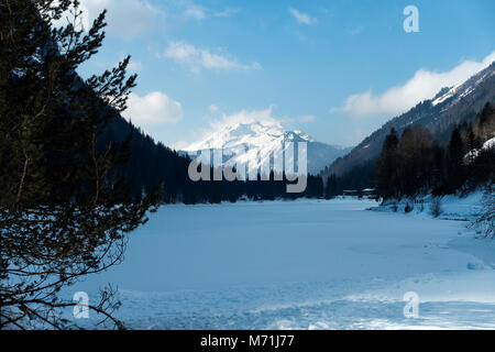 The Beautiful Frozen Lac de Montriond with Snow Covered Roc D'Enfer Mountain from Ardent Haute Savoie Portes du Soleil France Stock Photo