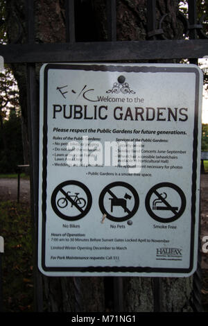 Entrance poster at Public garden Halifax  Nova Scotia no cycling no dogs no smoking sign signs respect gardens art artwork style picture art welcome Stock Photo